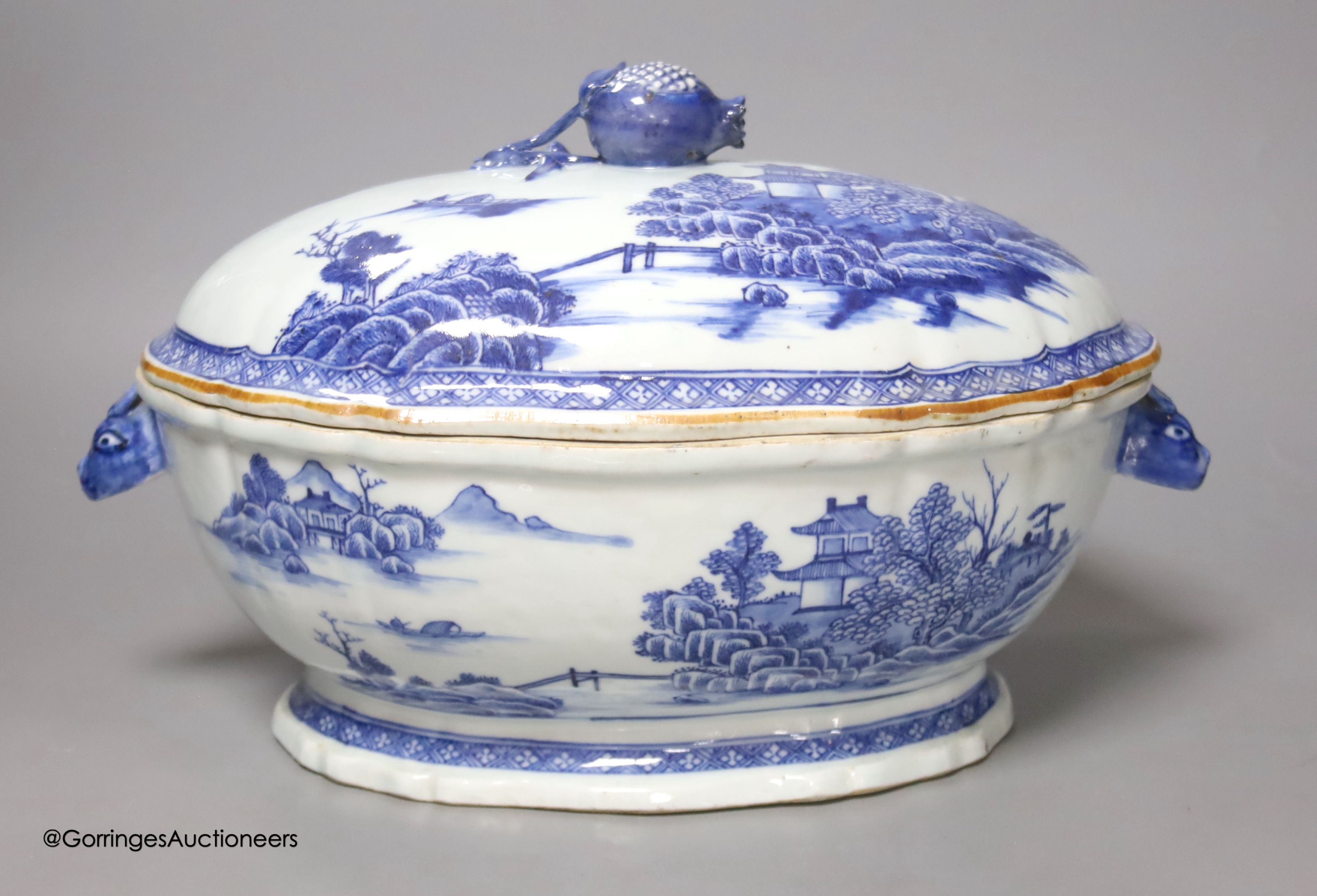 A 18th century Chinese export blue and white tureen and cover pomegranate finial, length 35cm